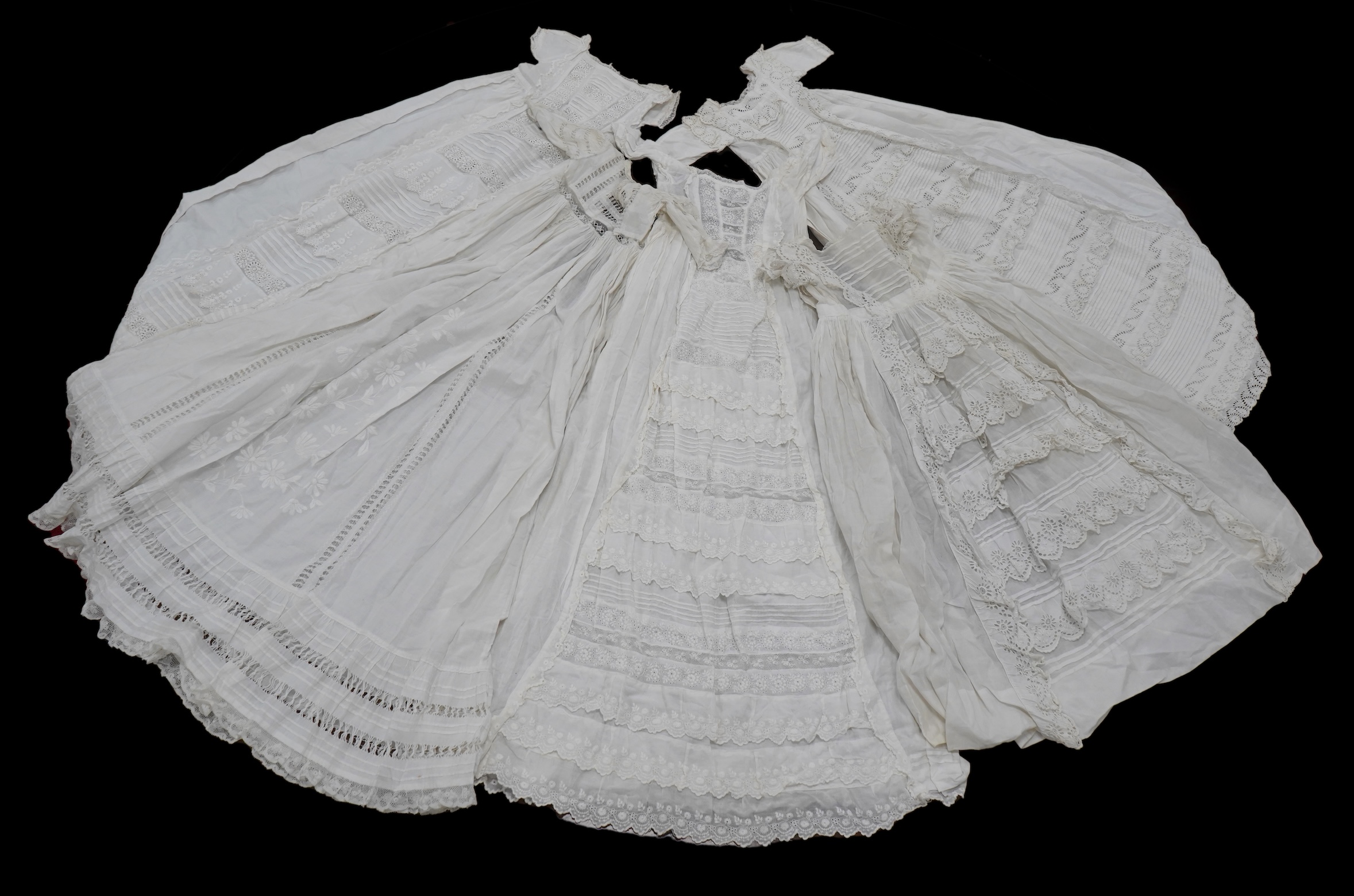 Five Victorian white worked fine cotton and lawn baby’s christening gowns. mostly worked with embroidery anglaise, feather stitching, tucking, drawn thread work and lace edging, longest 41cm. Condition - in good conditio